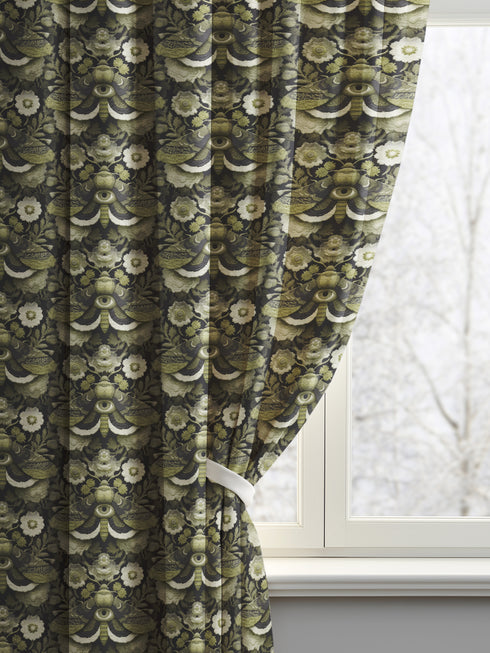 Blackout curtain panel featuring mystical moth pattern with all-seeing eyes, crescent moons, and botanical florals in olive green, cream, and charcoal colors on dark background. Heavyweight polyester fabric with rich satiny texture, rod pocket construction, gothic home decor, witchy aesthetic, occult symbolism, apothecary style window treatment for bedroom or living room